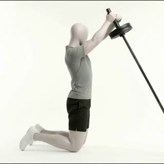 Exécution de l'exercice rotation obliques landmine à genoux, muscles sollicités : abdominaux / core, avec barre
