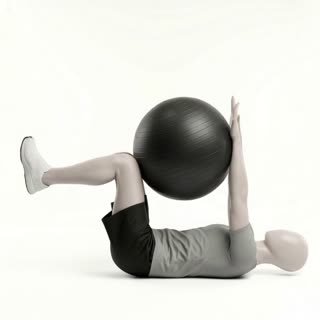 Exécution de l'exercice deadbug avec ballon de stabilité, muscles sollicités : abdominaux / core, avec accessoires